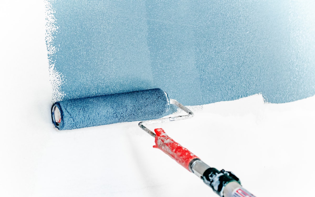 Fresh coat of paint rolling onto a wall